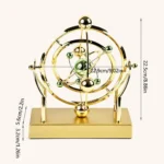 Cosmic Celestial Motion Ornament in a dark room, LED lights highlighting the Newton's Cradle and planet details.