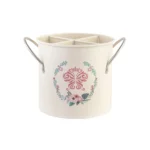 4-grid iron kitchen utensil storage box with chopsticks, spoons, and forks neatly organized on a countertop