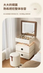 Modern lifting vanity table with mirror in cream finish, featuring rotating top and adjustable height for bedroom use