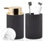 White foaming soap dispenser with farmhouse charm on a marble bathroom countertop.