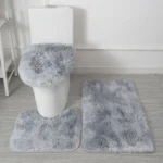 Plush bathroom rug set with toilet lid cover and mat in a cozy bathroom