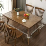 Elegant waterproof table cover with retro fringed lace on a dining table