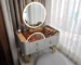 Elegant luxury dressing table with storage drawers and mirror in a modern bedroom setting