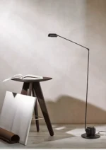 Floor lamp positioned in a corner, casting shadows and creating a cozy atmosphere.