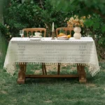 Retro polka dot tablecloth with fringe on a wooden table