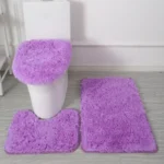 Plush bathroom rug set with toilet lid cover and mat in a cozy bathroom