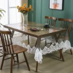 Elegant waterproof table protector with lace embroidery on a rectangular dining table
