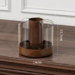 Large desk accessories holder in black, rotating to reveal all compartments on a minimalist desk.