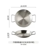 Stainless steel paella pan with double ears on a stove