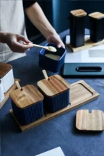 Ceramic kitchen storage container set with matte striped design and spoon