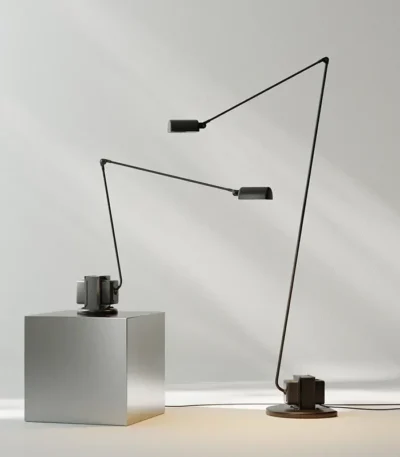 Italian design replica black floor lamp with tall stand and round shade, isolated on white background.