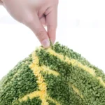 Soft absorbent bath mat in bathroom with banana leaf texture
