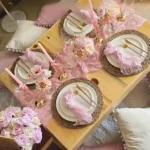 Boho cheesecloth table runner and napkins set as rustic table linens on a wooden table