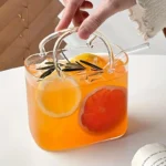 Korean ins style handbag shaped glass cup with straw on table