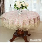 Elegant lace tablecloth with rose gold embroidery on a dining table
