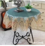 Elegant lace tablecloth with rose gold embroidery on a dining table