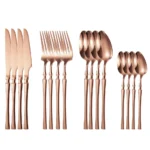 Goldoma 16-piece stainless steel silverware set with forks, knives, and spoons on a wooden table