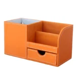 Leather PU remote storage box on a living room table next to a sofa.