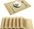 Gold weave placemats on a dining table with plates and cutlery