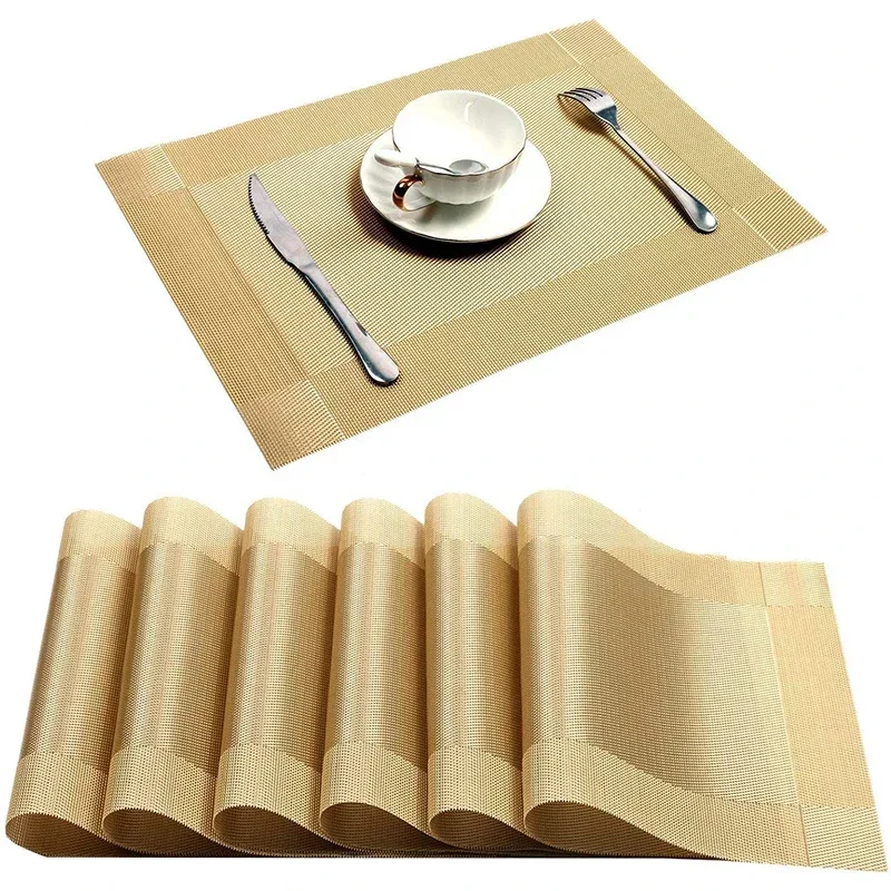 S096a38b851994312b4128bbbefc994ect.webp Gold weave placemats on a dining table with plates and cutlery