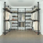 Freestanding coat rack with hooks holding jackets and bags in an entryway, adjustable design with sturdy steel frame