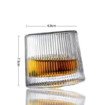 Rotating whiskey glass with wooden base on a bar table