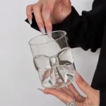 Elegant pink bow glass cup with heat-resistant borosilicate glass, perfect for champagne and cold drinks