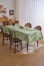 French country tablecloth with retro plaid pattern and lotus leaf edge on a dining table