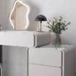 Modern makeup vanity table with mirror and storage drawer in bedroom setting