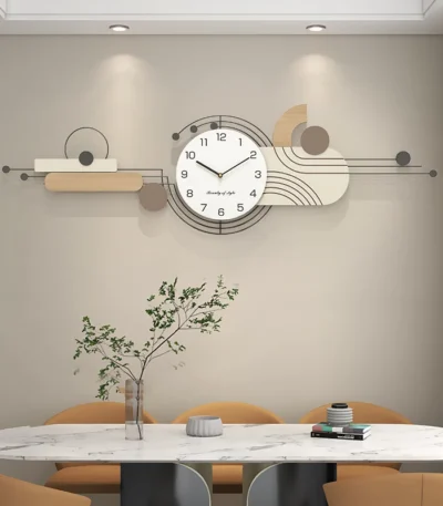Contemporary wall clock with white round face and black numerals on a beige living room wall.