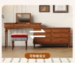 Minimalist oak wood dressing table with mirror, stool, and six drawers in a modern bedroom setting