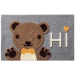Non slip bathroom rug with frog and bear flocking design on bathroom floor