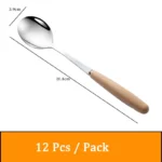 Stainless steel flatware set with wooden handles displayed on a table
