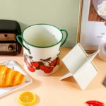 4-grid iron kitchen utensil storage box with chopsticks, spoons, and forks neatly organized on a countertop