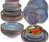 Grey-blue reactive glaze stoneware dinnerware set with plates and bowls on wooden table