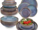 Grey-blue reactive glaze stoneware dinnerware set with plates and bowls on wooden table