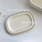 Handcrafted ceramic plates with underglaze floral design on a wooden table