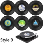 Set of vinyl record coasters on a wooden table