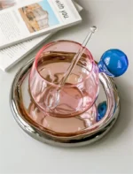 Nordic coffee cup set with saucer and spoon on a wooden table