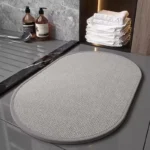 Quick dry bath mat with braided chenille texture in a modern bathroom
