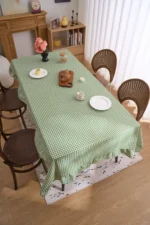 French country tablecloth with retro plaid pattern and lotus leaf edge on a dining table
