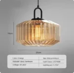 Modern colored glass pendant lamp illuminating a cozy dining room with vibrant hues
