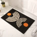 Modern abstract art non slip bathroom rug with vibrant colors and textured surface on a bathroom floor