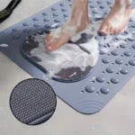 Oblong non-slip bath mat with suction cups on shower floor