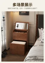 Wooden makeup vanity with mirror and stool in a modern bedroom setting