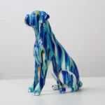 Top-down view of the boxer dog resin craft with bright colors.