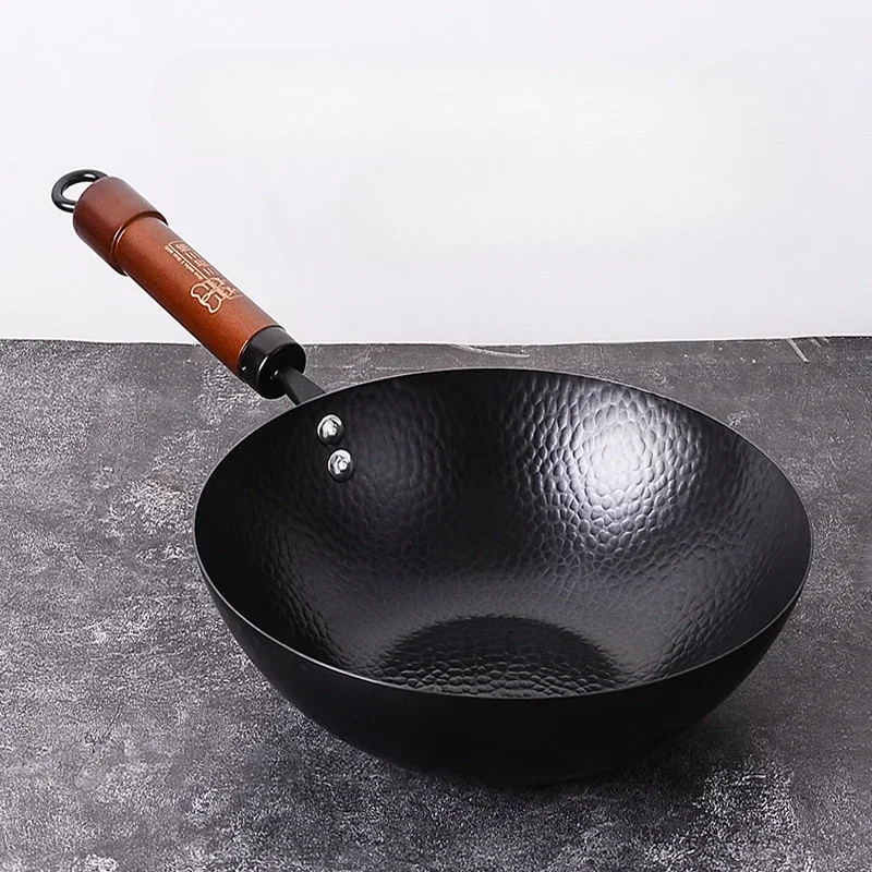 Small iron skillet on induction cooktop with eggs and herbs