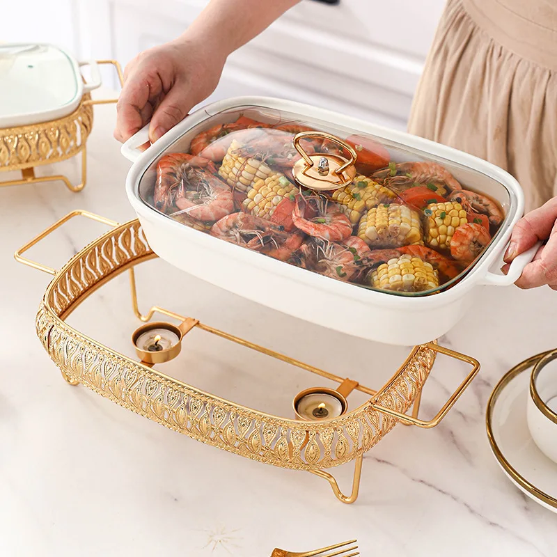 S198c1b46df3d4ac29186978719bb4492l.webp Ceramic dinnerware set with lid and candle holder on a wooden table