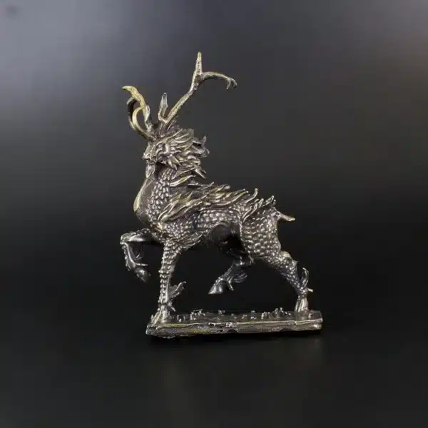 Retro copper figurine of a fire kirin on a desk
