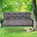 Outdoor bench cushion on a wooden garden bench with vibrant floral pattern